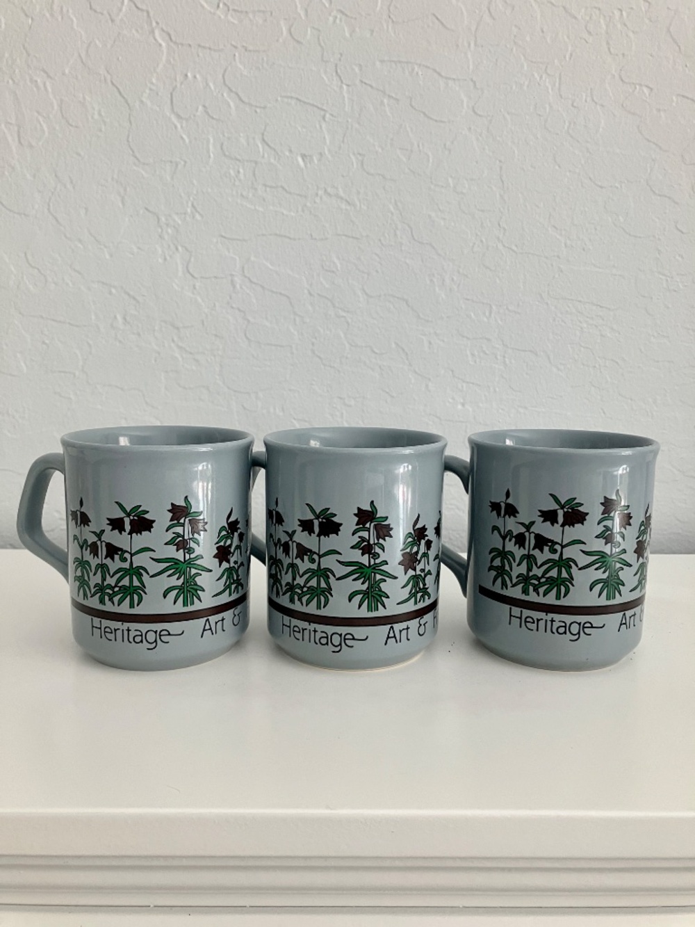 Set of three slate blue ceramic botanical coffee mugs made in the UK